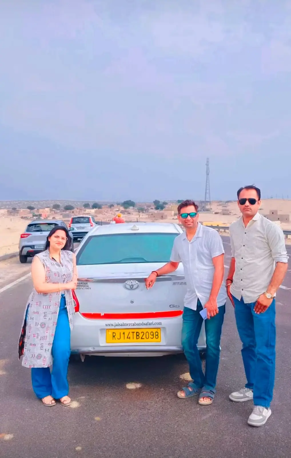 Travellers with their taxi on an outstation trip