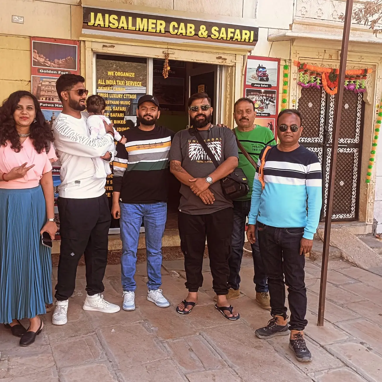 Guests outside the Jaisalmer Cab and Safari office