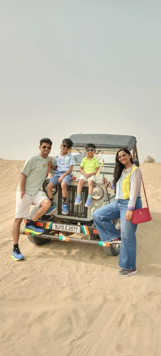 Family on an open jeep in the desert