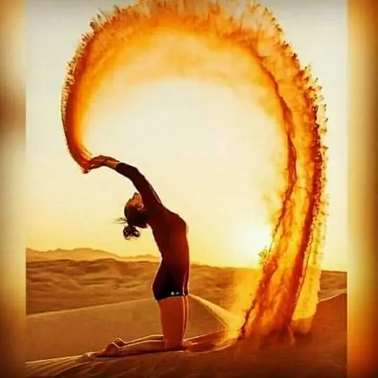 Yoga pose against a dune sand splash
